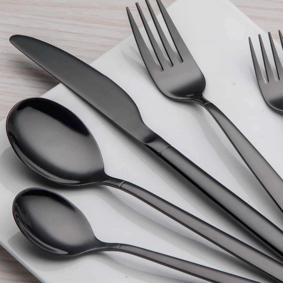 Detail of Berglander shiny black stainless steel flatware